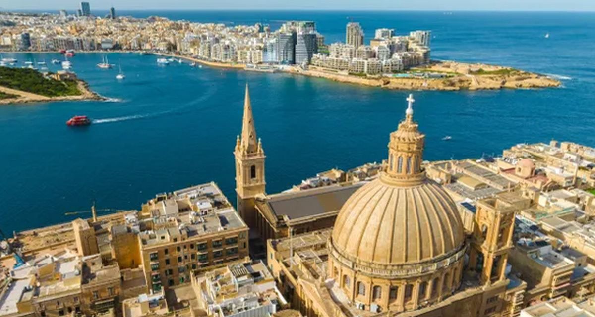 Aerial view of Valletta&rsquo;s domed church and church spire, looking across the harbor to Sliema